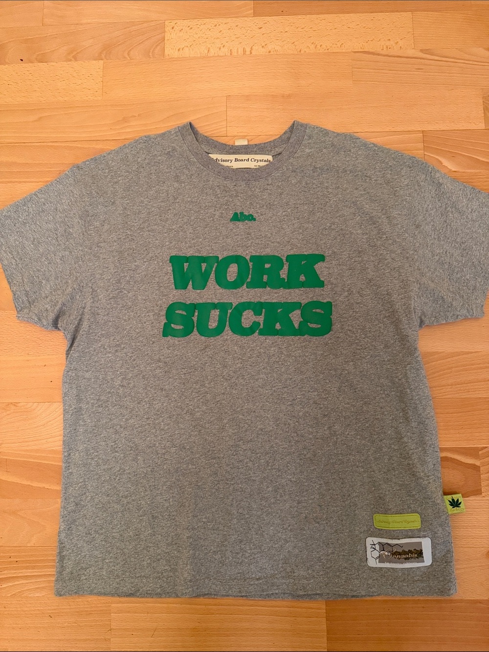 Advisory Board Crystals ‘Work Sucks' Grey Tee with Green Print